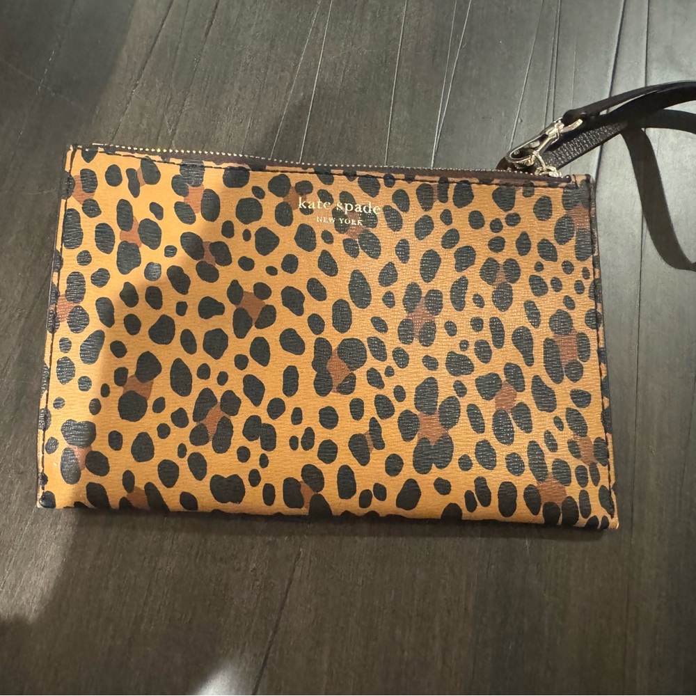 Kate Spade, New York leopard print bifold wallet.